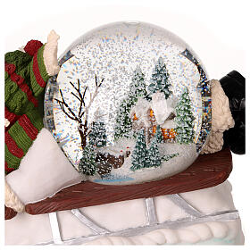 Snow globe: snowman on a sled with lights, music and automatic snowfall, 6x8x6 in