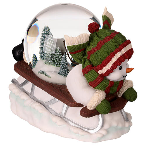 Snow globe: snowman on a sled with lights, music and automatic snowfall, 6x8x6 in 4