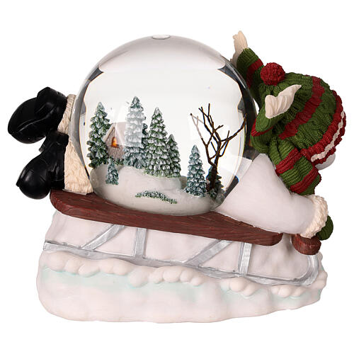 Snow globe: snowman on a sled with lights, music and automatic snowfall, 6x8x6 in 6