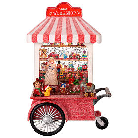Schneekugel, Weihnachtsmanns Spielzeugwerkstatt auf Wagen – Licht, Musik, Schneewirbel, H 27,3 cm, 17,8 × 10,2 cm