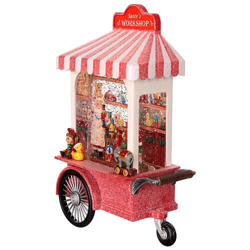 Schneekugel, Weihnachtsmanns Spielzeugwerkstatt auf Wagen – Licht, Musik, Schneewirbel, H 27,3 cm, 17,8 × 10,2 cm 4