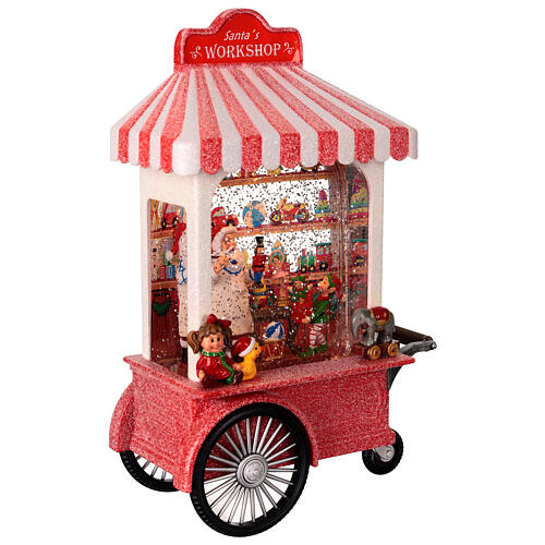 Schneekugel, Weihnachtsmanns Spielzeugwerkstatt auf Wagen – Licht, Musik, Schneewirbel, H 27,3 cm, 17,8 × 10,2 cm 6