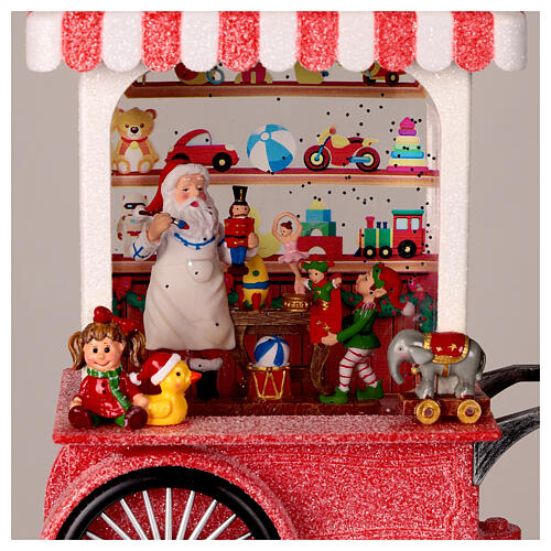 Palla neve laboratorio di Babbo Natale luci musica 25x20x10 cm 2