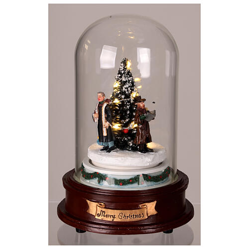 Glass dome with Christmas carolers around a tree, lights and motion, 8x6x6 in 3