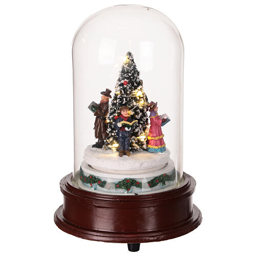 Glass dome with Christmas carolers around a tree, lights and motion, 8x6x6 in 5