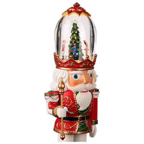 Nutcracker with illuminated Christmas tree in its glass hat, 5x5x16 in 5