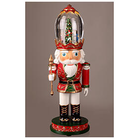 Figurka Dziadek do orzechów z obrotową sceną bożonarodzeniową w szklanym kapeluszu, podświetlana, 12x12x40 cm