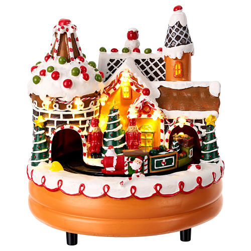 Gingerbread miniature town with train in motion, 8x8x8 in 1