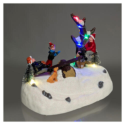 Tobogán con niños iluminado con música 18x11x14 cm 4