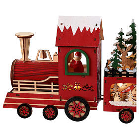 Santa Claus' train, painted wood and lights, 22x4x8 in