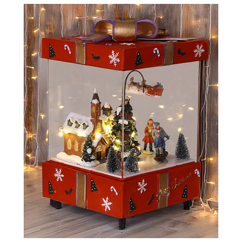 Pacco regalo rosso con chiesa slitta Babbo Natale in movimento 15x15x25 cm 2