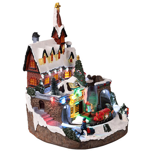 Illuminated church with animated train, 25x25x30 cm 4