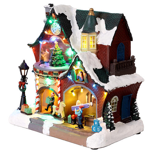 Casa Navideña iluminada con música y movimiento 27x16x26 cm 3