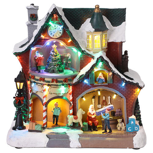 Casa natalina iluminada com música e movimento 27x16x26 cm 1