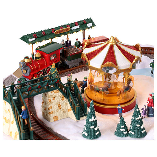 Christmas village set: train on snowy landscape, music motion and lights, 6x20x16 in 4