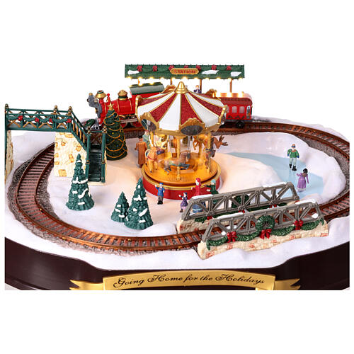 Christmas village set: train on snowy landscape, music motion and lights, 6x20x16 in 6