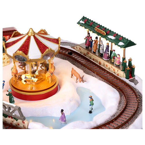 Christmas village set: train on snowy landscape, music motion and lights, 6x20x16 in 7