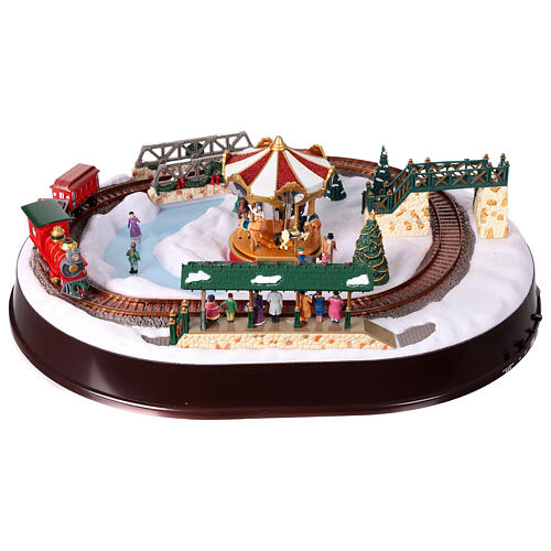 Christmas village set: train on snowy landscape, music motion and lights, 6x20x16 in 11