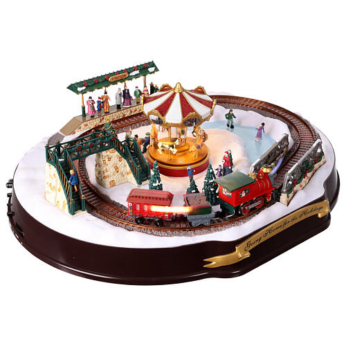 Christmas village set: train on snowy landscape, music motion and lights, 6x20x16 in 22