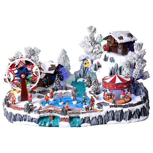 Pueblo navideño LED con teleférico, patinadores y noria 65x45x31 cm 1