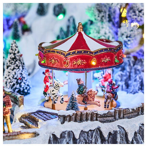 Pueblo navideño LED con teleférico, patinadores y noria 65x45x31 cm 4