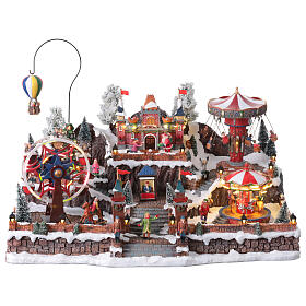 Pueblo navideño Parque Atracciones globo aerostático iluminado música 65x45x35 cm transformador