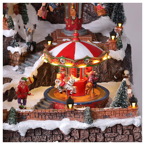 Pueblo navideño Parque Atracciones globo aerostático iluminado música 65x45x35 cm transformador 3