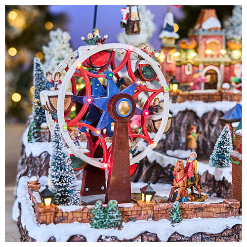 Pueblo navideño Parque Atracciones globo aerostático iluminado música 65x45x35 cm transformador 7