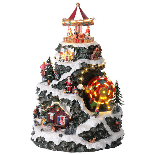 Villaggio Natalizio montagna LED movimento giostre musica 35x35x50 cm trasformatore 1