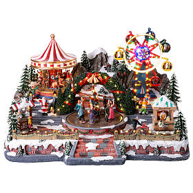 Village de Noël Deluxe Fête foraine en mouvement LEDs colorées 65x60x40 cm