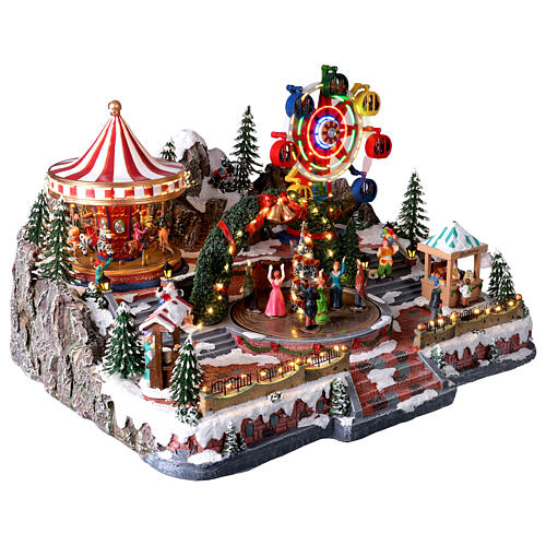 Villaggio Natalizio Deluxe Luna Park in movimento LED colorati 65x60x40 cm corrente 8