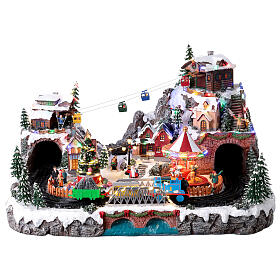 Pueblo navideño Deluxe música movimiento tren teleférico LED coloridos corriente 70x60x40 cm