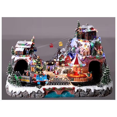 Pueblo navideño Deluxe música movimiento tren teleférico LED coloridos corriente 70x60x40 cm 9