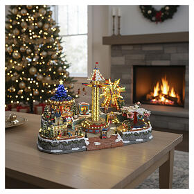 Winterszene „Jahrmarkt“ – Deluxe-Ausführung mit LEDs, Turmkarussell, Pferdekarussell und Riesenrad, 95 × 65 × 60 cm, Strombetrieb