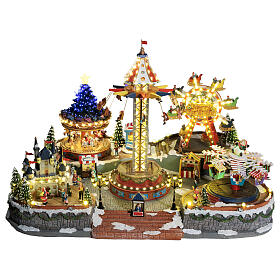Aldea Navideña deluxe Parque de Atracciones movimiento LED coloridos 95x65x60 cm corriente