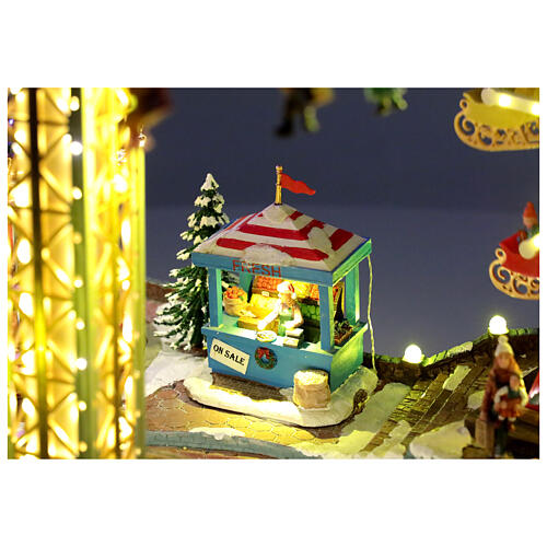 Aldea Navideña deluxe Parque de Atracciones movimiento LED coloridos 95x65x60 cm corriente 6
