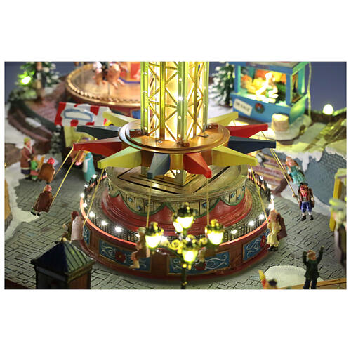 Aldea Navideña deluxe Parque de Atracciones movimiento LED coloridos 95x65x60 cm corriente 10