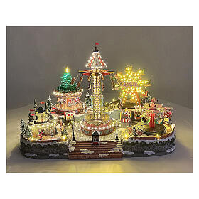 Village de Noël Deluxe parc d'attractions mouvement LEDs colorés 95x65x60 cm courant