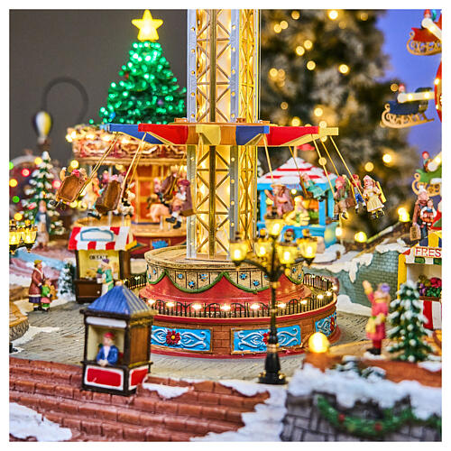 Village de Noël Deluxe parc d'attractions mouvement LEDs colorés 95x65x60 cm courant 5