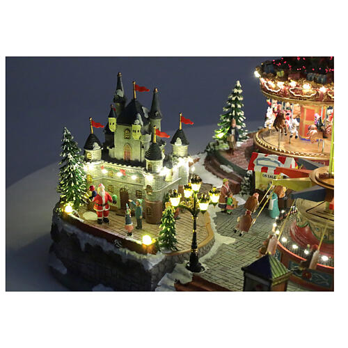 Villaggio Natalizio deluxe Luna Park movimento LED colorati 95x65x60 cm corrente 12
