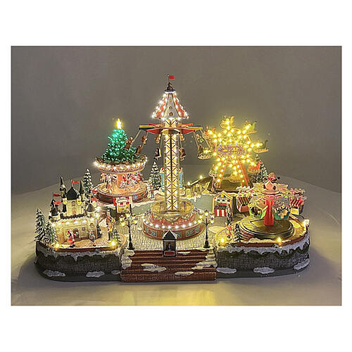 Miasteczko bożonarodzeniowe Deluxe Luna Park z ruchem i kolorowym oświetleniem LED, 95x65x60 cm, zasilanie sieciowe 2