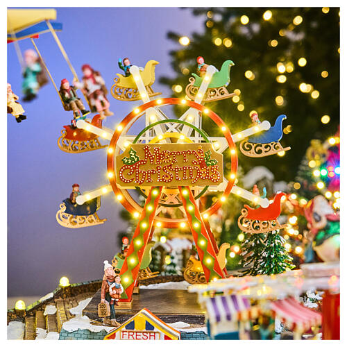 Miasteczko bożonarodzeniowe Deluxe Luna Park z ruchem i kolorowym oświetleniem LED, 95x65x60 cm, zasilanie sieciowe 3
