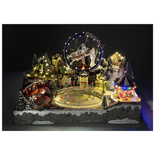 Winterszene – Deluxe-Ausführung mit LEDs, Schlittschuhläufern, Zug, Schlitten und Karussell, 65 × 55 × 45 cm, Strombetrieb 11