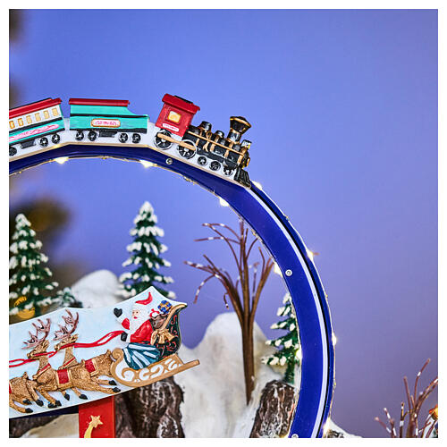 Winterszene – Deluxe-Ausführung mit LEDs, Schlittschuhläufern, Zug, Schlitten und Karussell, 65 × 55 × 45 cm, Strombetrieb 13