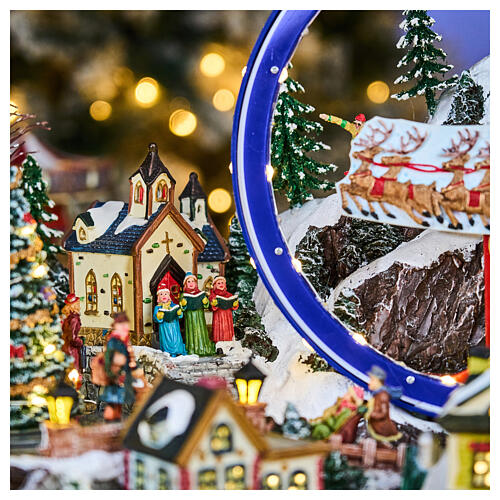 Deluxe Christmas Village with skaters, train, sleigh, and merry-go-round with LED lights, motion and music, 65x55x45 cm 6