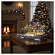 Deluxe Christmas Village with skaters, train, sleigh, and merry-go-round with LED lights, motion and music, 65x55x45 cm s5