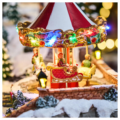 Village de Noël Deluxe patineurs manège musique LEDs mouvement 65x55x45 cm électrique 4