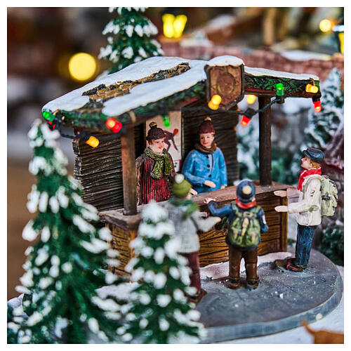 Village de Noël Deluxe patineurs manège musique LEDs mouvement 65x55x45 cm électrique 7