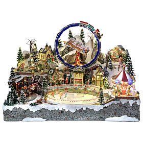 Villaggio Natalizio deluxe pattinatori giostre movimento LED musica 65x55x45 cm corrente
