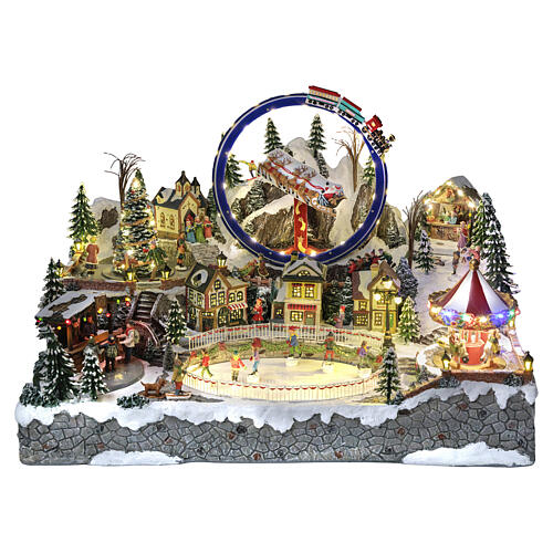 Cenário natalino Deluxe com patinadores, comboio, trenó e carrosséis 65x50x45 cm corrente eléctrica 1